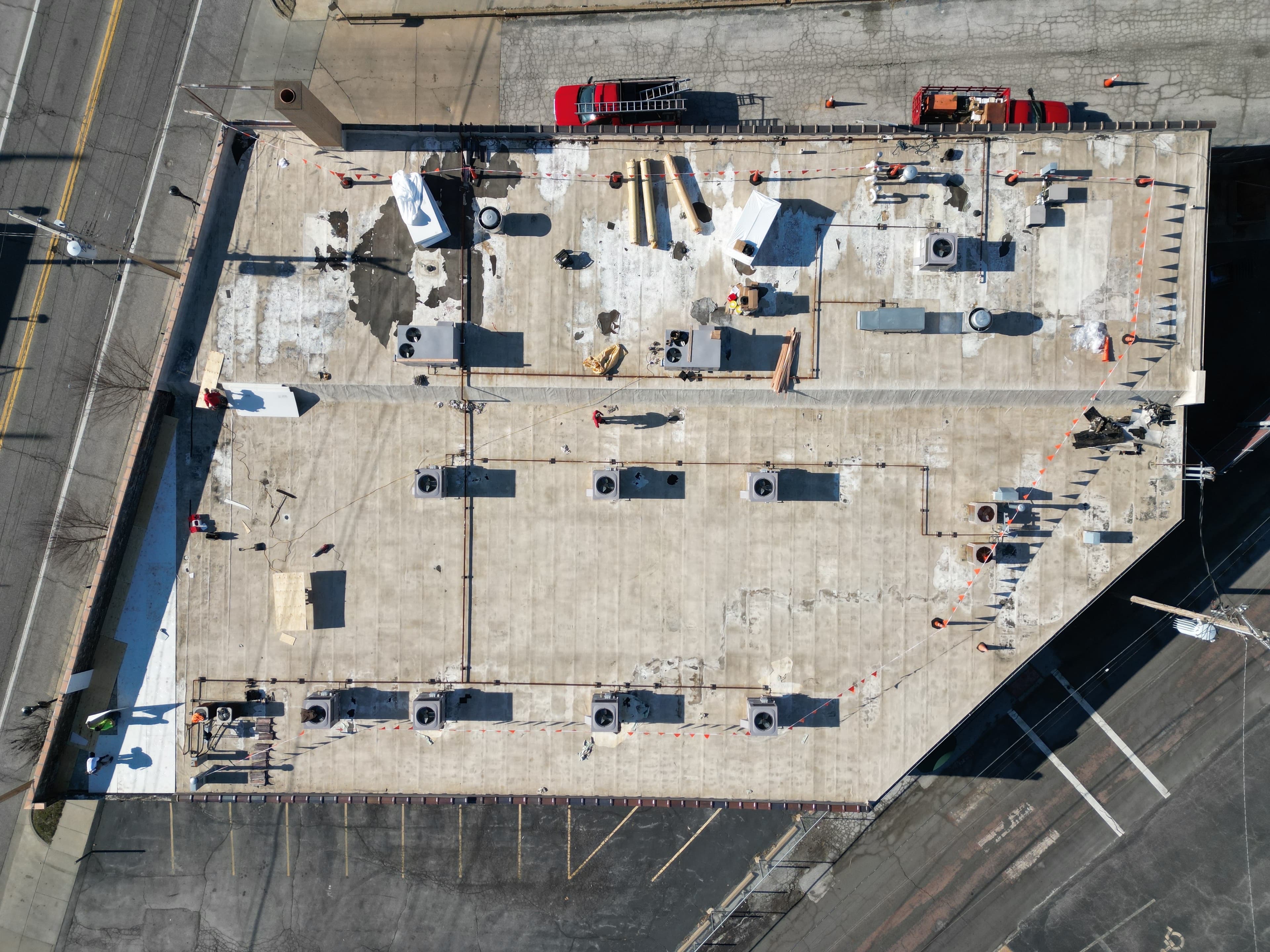 Large-Scale Commercial EPDM Flat Roof Replacement — Retail Strip Building. Before