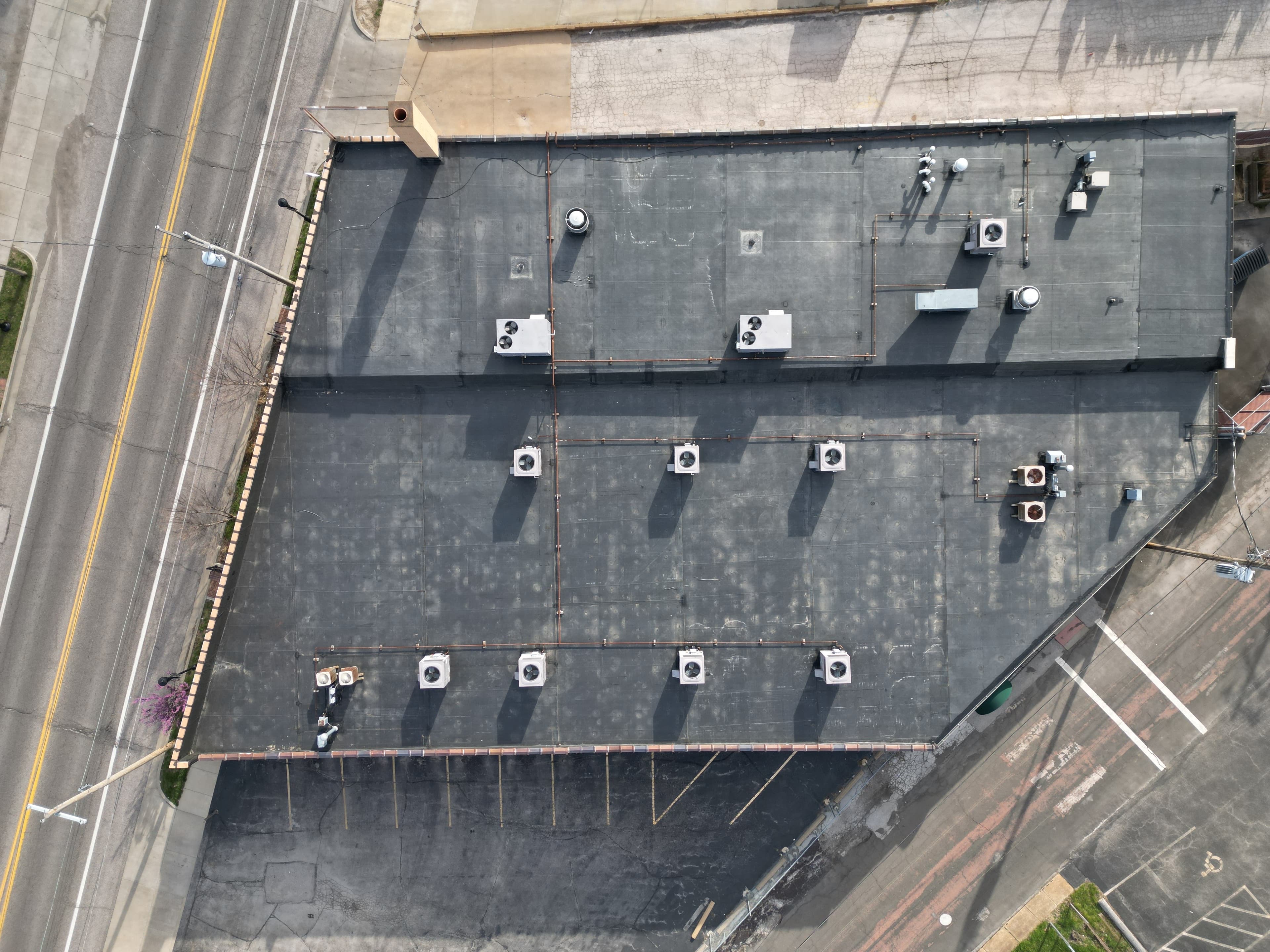 Large-Scale Commercial EPDM Flat Roof Replacement — Retail Strip Building. After
