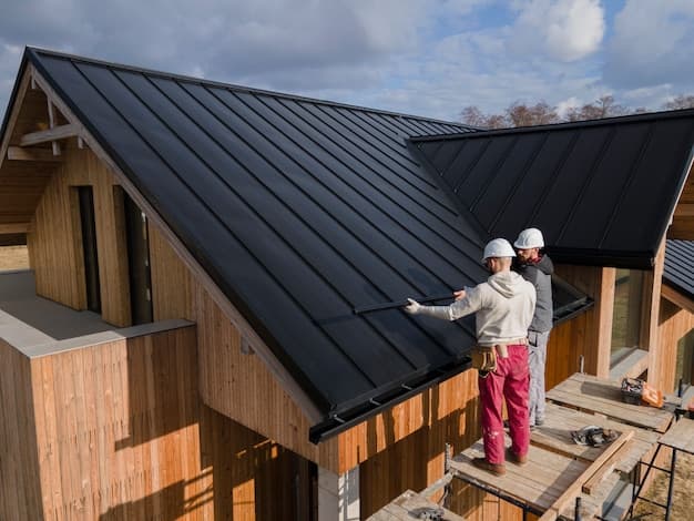 Professional roofers working together on a residential roof
